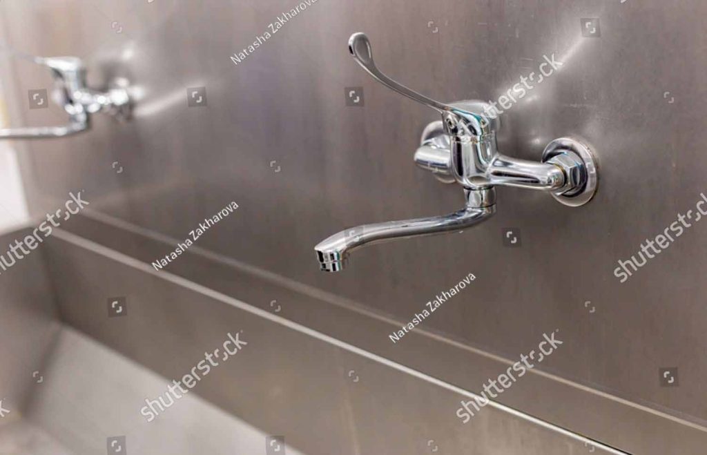 Stock Photo Close Up Of A Chrome Industrial Style Public Water Two Taps In The Surgery Department At The 2416490427