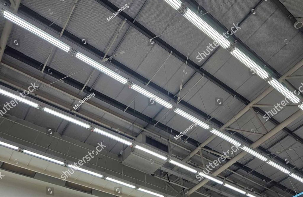 Stock Photo Fluorescent Lamps On Warehouse Ceiling 2517612507